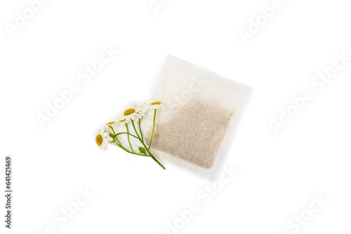 A bag of chamomile tea. Herbal chamomile tea in a bag isolated on white background. Close-up. healthy herbal drinks, immunity tea. Natural healer concept.Place for text.
