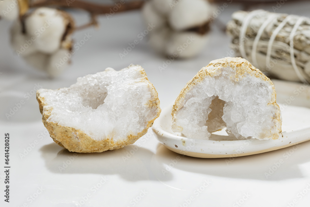 Open Cracked Pure Quartz Crystals Geode on the Table Open Cracked Pure Quartz Crystals Geode on the Table