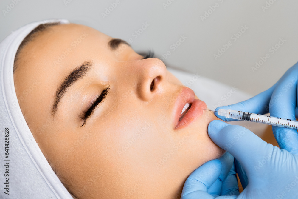 Beauty injection for lip augmentation in a beauty salon. 