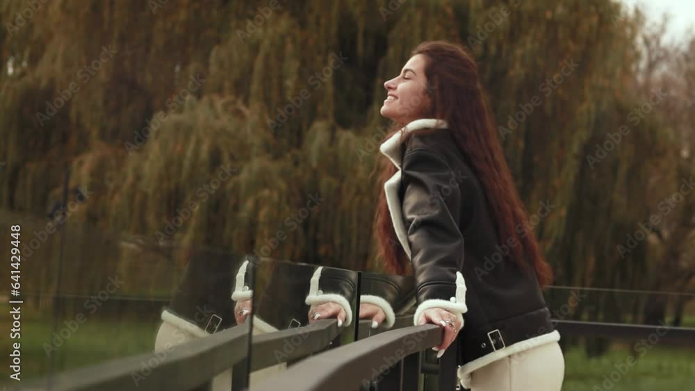 Slow motion, happy joyful woman with long hair standing alone outdoor glass balcony cold moody cloudy weather strong wind, smiling laughing looking away
Slow motion, happy joyful woman with long hair standing alone outdoor glass balcony cold moody cloudy weather strong wind, smiling laughing looking away