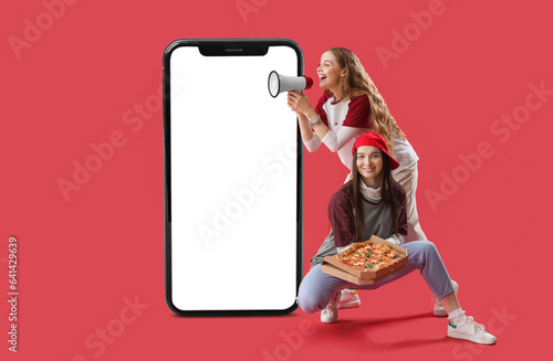 Young women with box of tas...