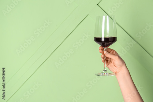 Female hand holding glass o...