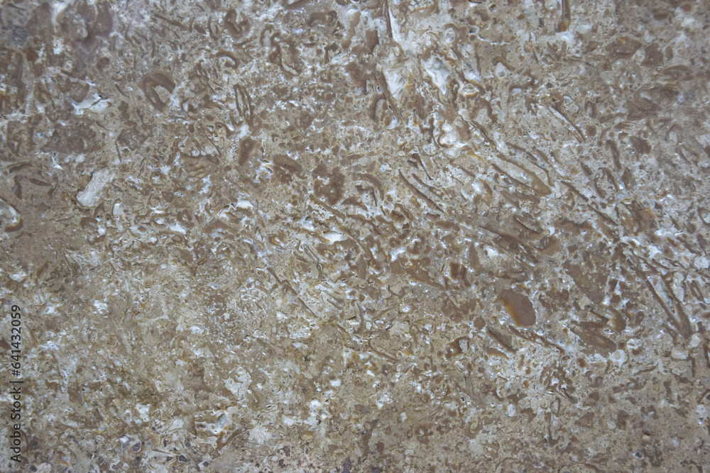 Background of brown polished stone texture with abstract pattern, for design, uneven surface, full frame. Copy space. Selective focus. Background of brown polished stone texture with abstract pattern, for design, uneven surface, full frame. Copy space. Selective focus.
