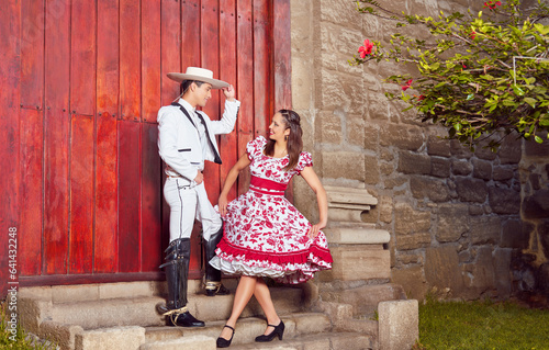 portrait young heterosexual couple posing dressed in national huaso clothes
