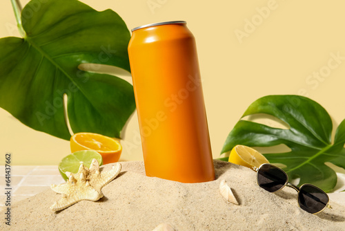 Can of soda with seashells,...