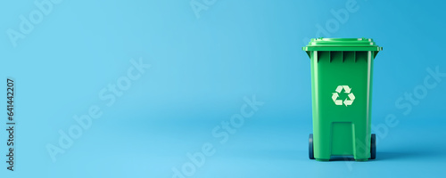 Green plastic recycle bin eco banner with copy space isolated on blue background