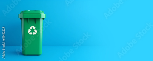Green plastic recycle bin eco banner with copy space isolated on blue background