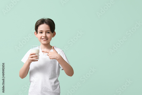 Happy little boy pointing a...
