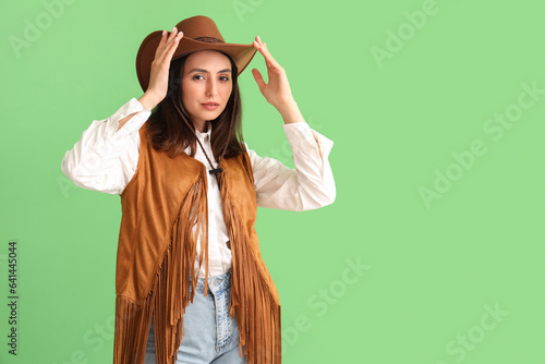 Beautiful cowgirl on green ...