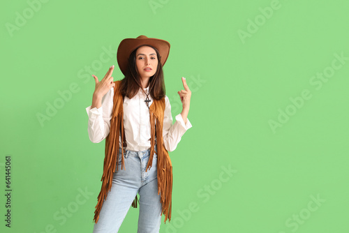 Beautiful cowgirl showing g...