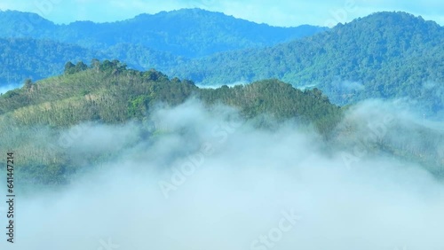 Drone glides gracefully through the air, it captures the delicate dance between the fog and the landscape. as if time itself has slowed down to allow nature's beauty to take center stage. Thailand.
 photo