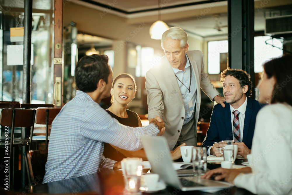 Group of business people having a meeting in a cafe bar Group of business people having a meeting in a cafe bar