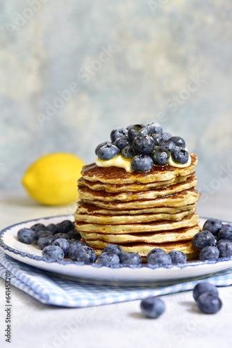 Lemon pancakes with fresh blueberry and whipped cream.