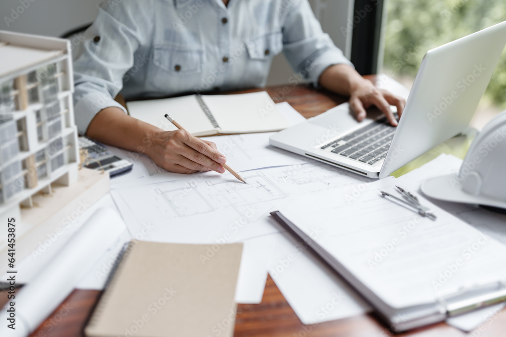 Engineer or interior Architects designer construction plans on blueprint Engineer or interior Architects designer construction plans on blueprint