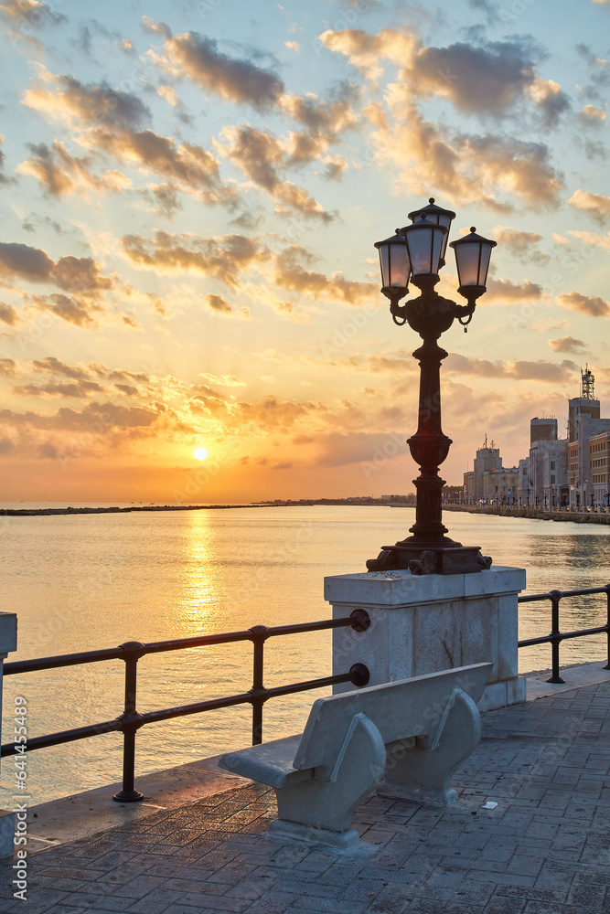 Bari seafront. Colorful amazing sunset. Coastline and city view.