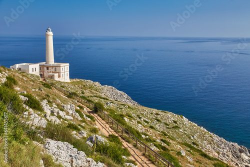 lighthouse of Cape of Otranto in Apulia standing on hard granite rocks is the most easterly point of Italy, marks the meeting of the Ionian Sea and the Adriatic Sea. photo