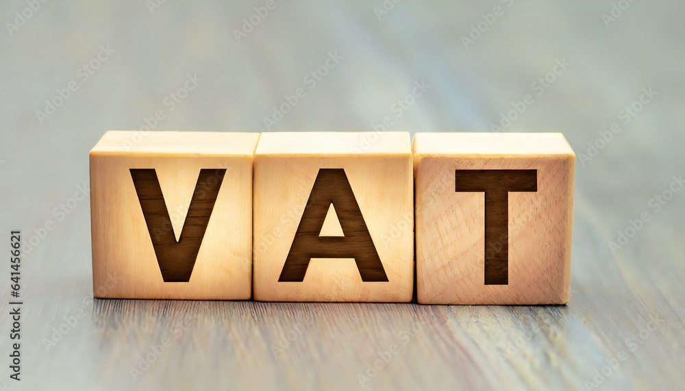 Vat acronym for value added tax in wooden alphabet letters Stock