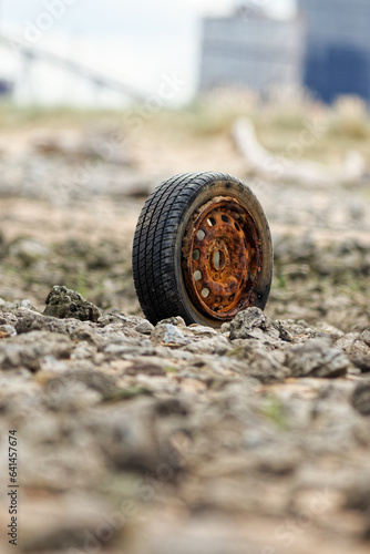Wallpaper Mural Old rusty wheel and tire left on a beach in Redcar, North East England, UK Torontodigital.ca
