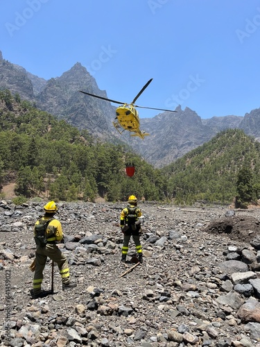 helicopter in the mountains, forest firefighters