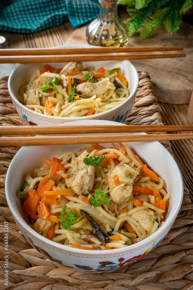 Fried noodles with chicken and vegetables. Fried noodles with chicken and vegetables.