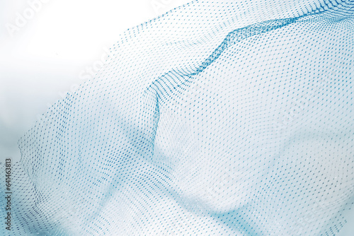 Closeup of blue plastic fishnet texture background photo