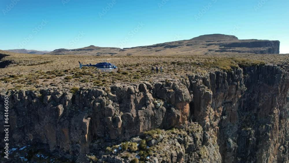 Aerial view of Cathedral Peak in Drakensberg mountains, at the Lesotho border in KwaZulu-Natal province, South Africa Aerial view of Cathedral Peak in Drakensberg mountains, at the Lesotho border in KwaZulu-Natal province, South Africa