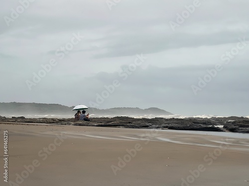 Couple sitting at the beach