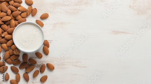 Alternative almond milk background with almond nuts and place for text. Plant based eco organic healthy product concept
