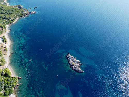aerial view of small wild rocky island aerial top down view  coral reef around. tourist boats  yachts in the sea. Travel destinations. Beautiful landscape. Drone flight