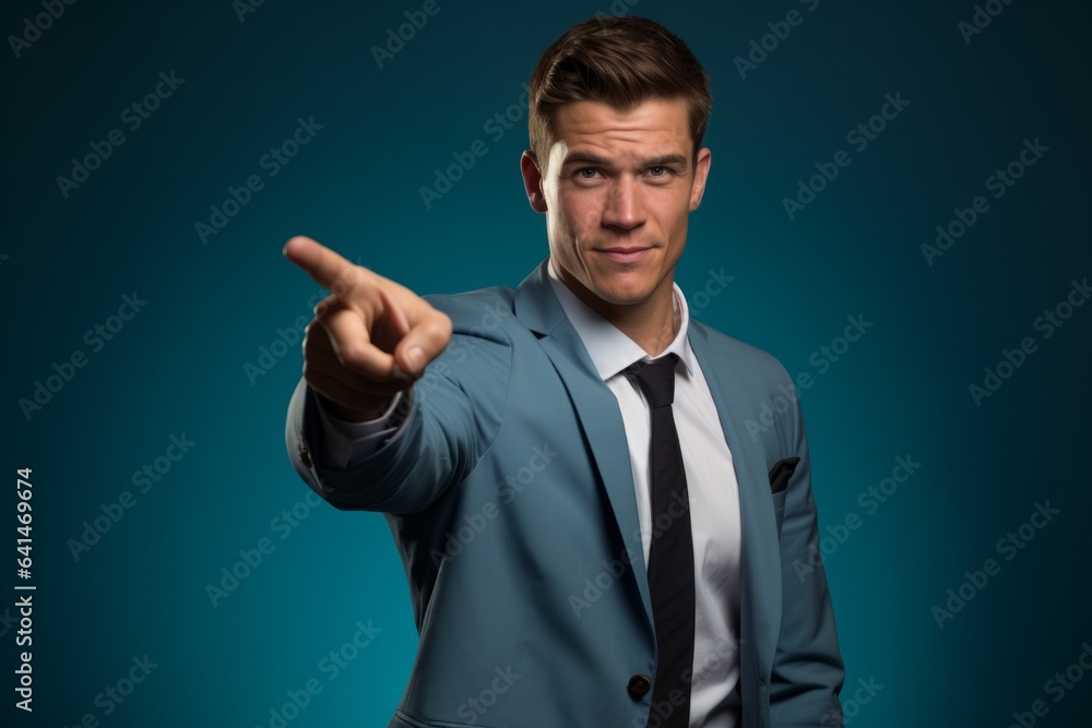 A businessman pointing his finger at the viewer A businessman pointing his finger at the viewer