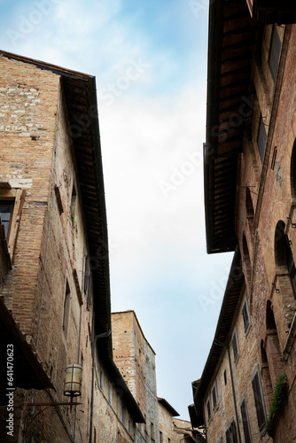 View of the roof of old buildings in italian town. Roof and sky