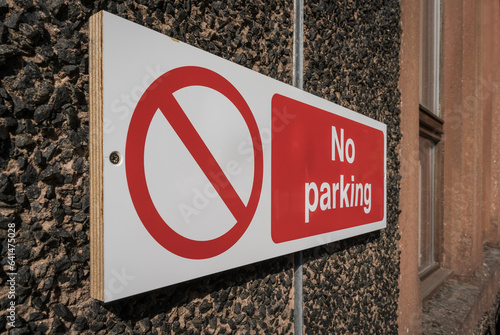 weathered no parking sign somwere in great britain photo