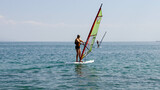 Windsurfing in the sea on a sunny summer day