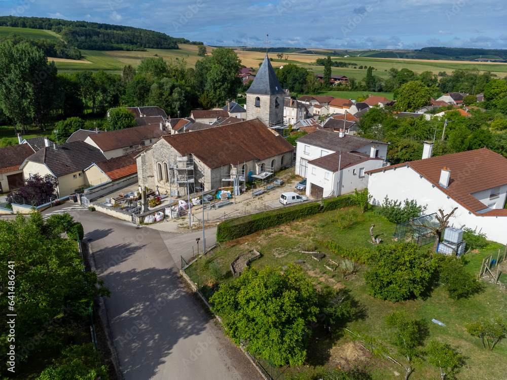 Aerial view on hilly vineyards and village Urville, champagne vineyards in Cote des Bar, Aube, south of Champange, France Aerial view on hilly vineyards and village Urville, champagne vineyards in Cote des Bar, Aube, south of Champange, France
