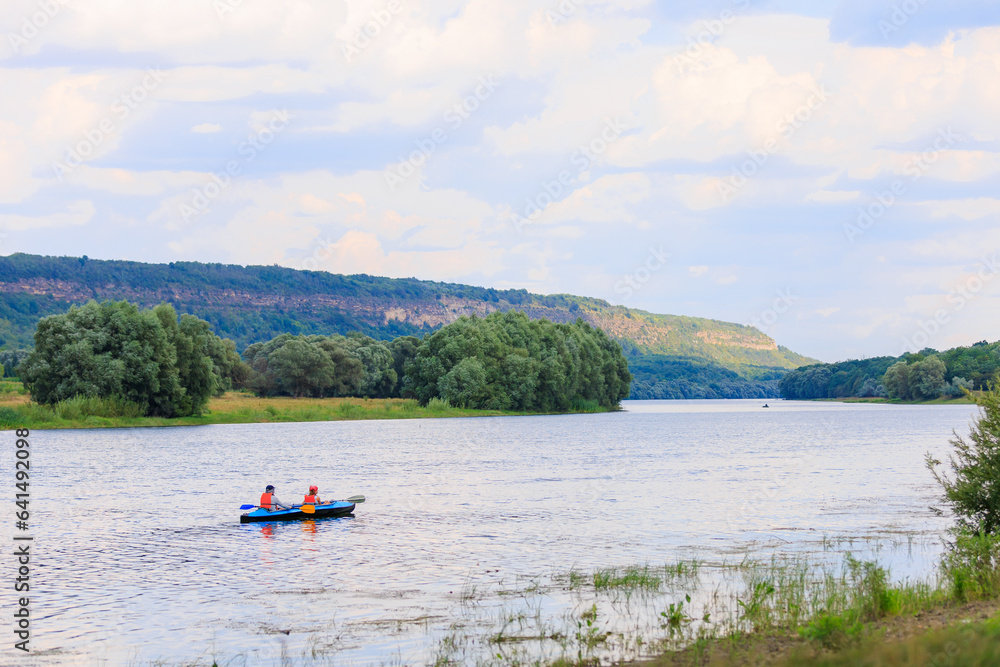 People travel along the river in a kayak. Rafting as a healthy lifestyle. Background