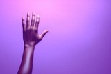 Person's hand reaching up into air. Suitable for concepts related to aspiration, achievement, help, support, and reaching for goals.