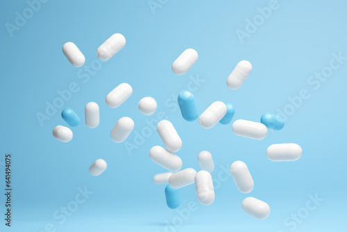 Captivating image capturing bunch of pills suspended in mid-air. Perfect for illustrating concepts related to medicine  pharmaceuticals  healthcare  addiction  or concept of choices and decisions.