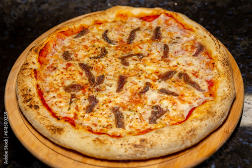 Traditional anchovy pizza (alicci) with artisan long-matured dough. "vera pizza" Neapolitan
