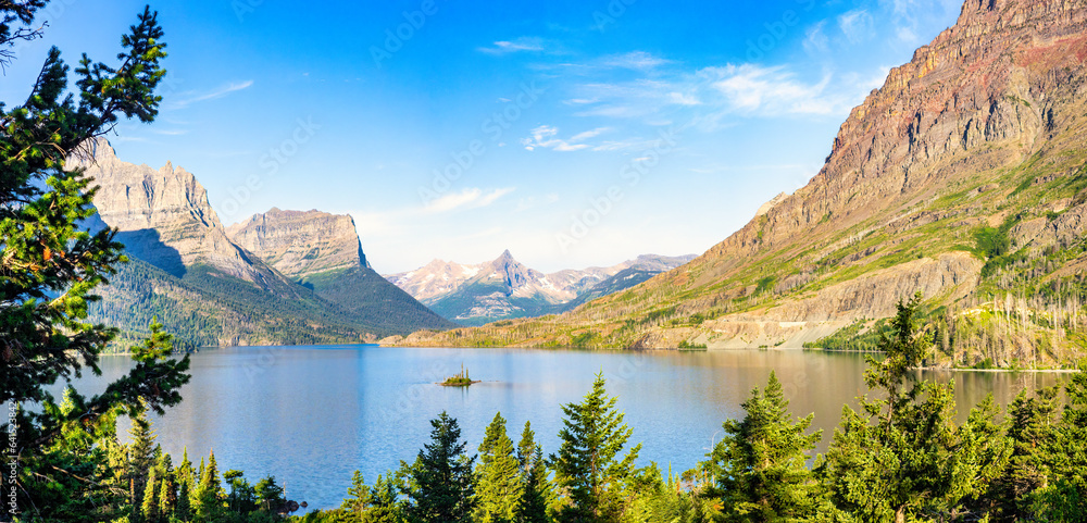 Sunrise panorama of St. Mary Lake and Wild Goose Island in Glacier National Park, Montana with Fusillade, Gunsight, Dusty Star, Little Chief and Mahtotopa Mountains in the background.