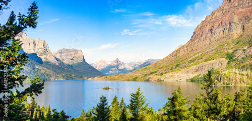 Sunrise panorama of St. Mary Lake and Wild Goose Island in Glacier National Park, Montana with Fusillade, Gunsight, Dusty Star, Little Chief and Mahtotopa Mountains in the background. photo