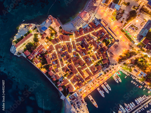 Budva city lights from Montenegro seen from above. Night view. Drone old town Budva at night