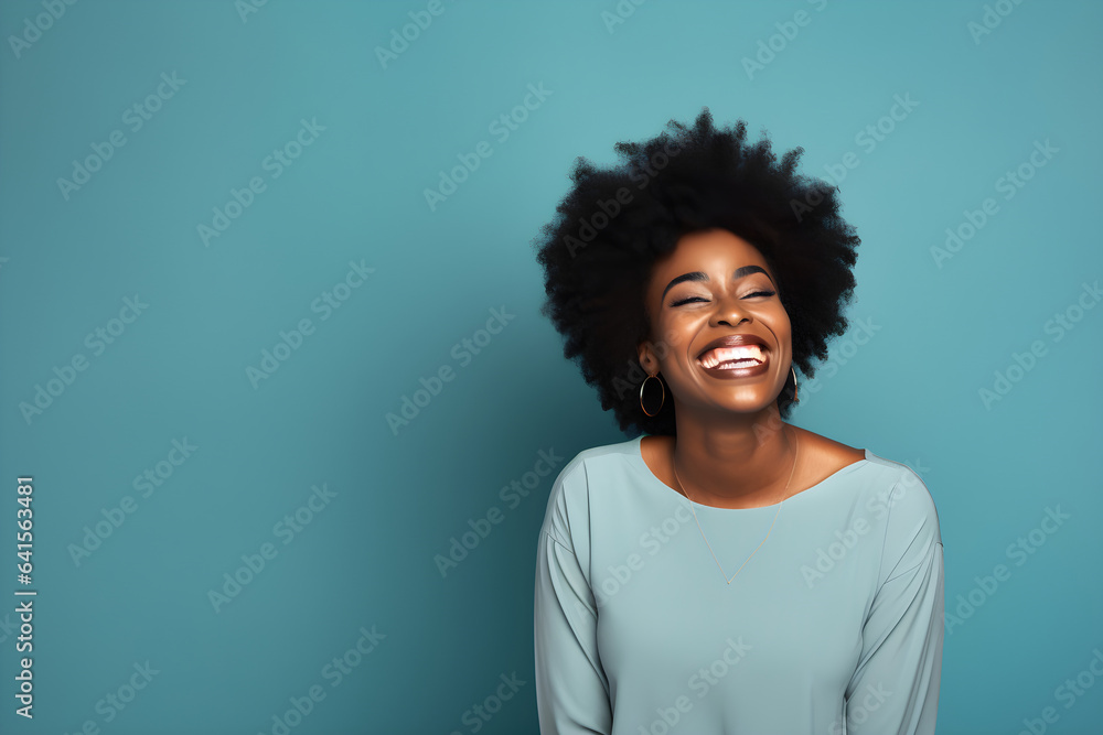 portrait of black woman smiling in a studio, plain colour background portrait of black woman smiling in a studio, plain colour background