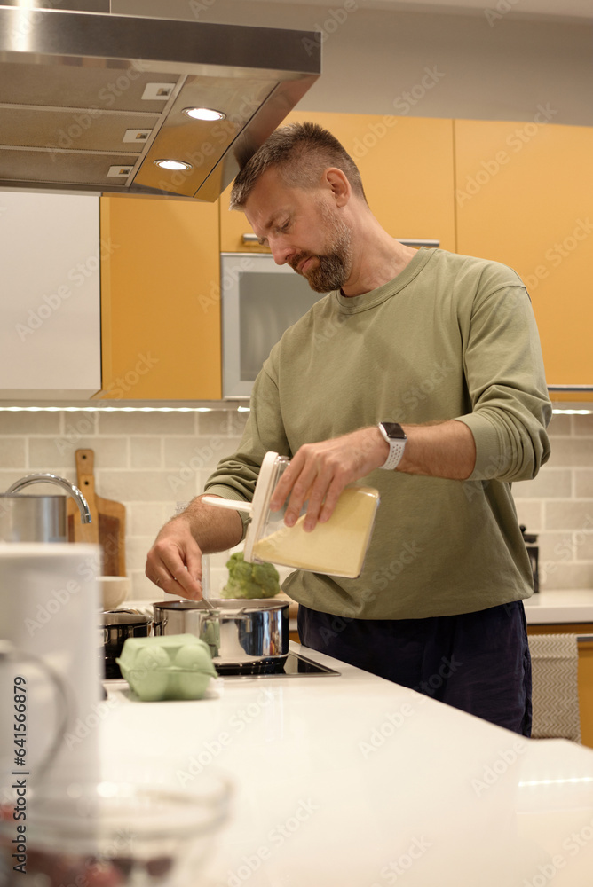 Man preparing breakfast porridge Man preparing breakfast porridge