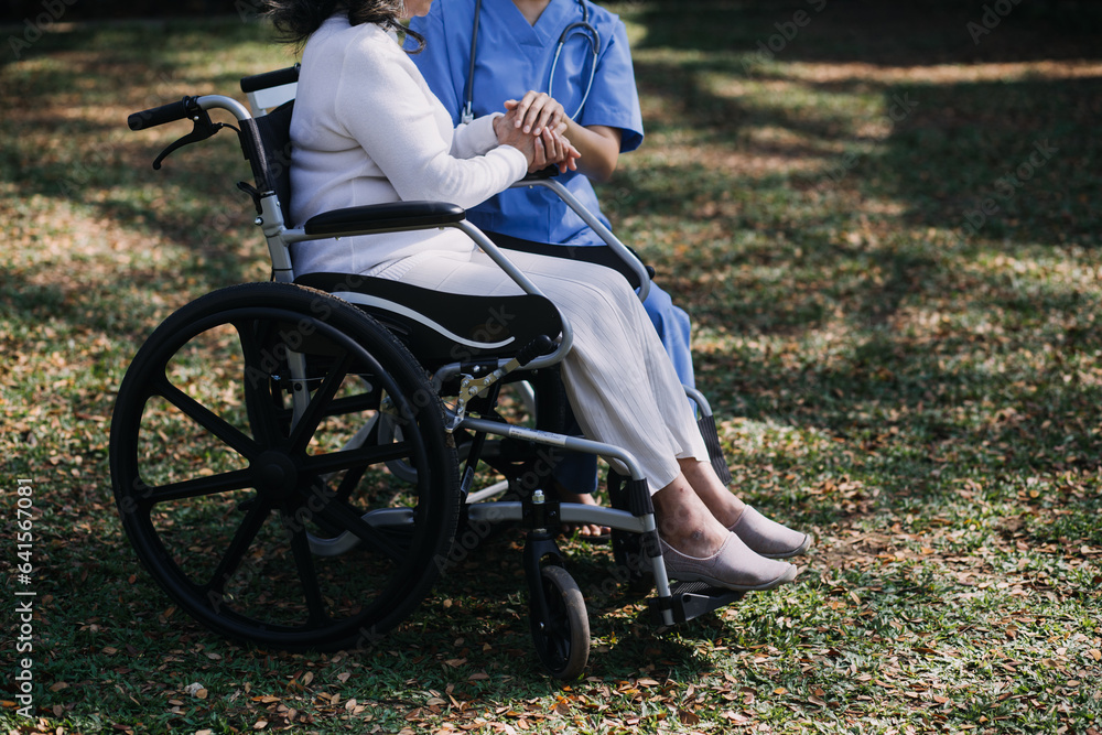 Fototapeta premium Asian young woman nurse at nursing home take care disabled senior man. Caregiver doctor serve physical therapy for older elderly patient to exercise and practice walking on walker or cane at backyard.