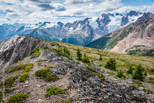 A rocky ridge in Bugaboo Provincial Park, BC overlooking Bugaboo Spire, glaciers, and other nearby peaks photo
