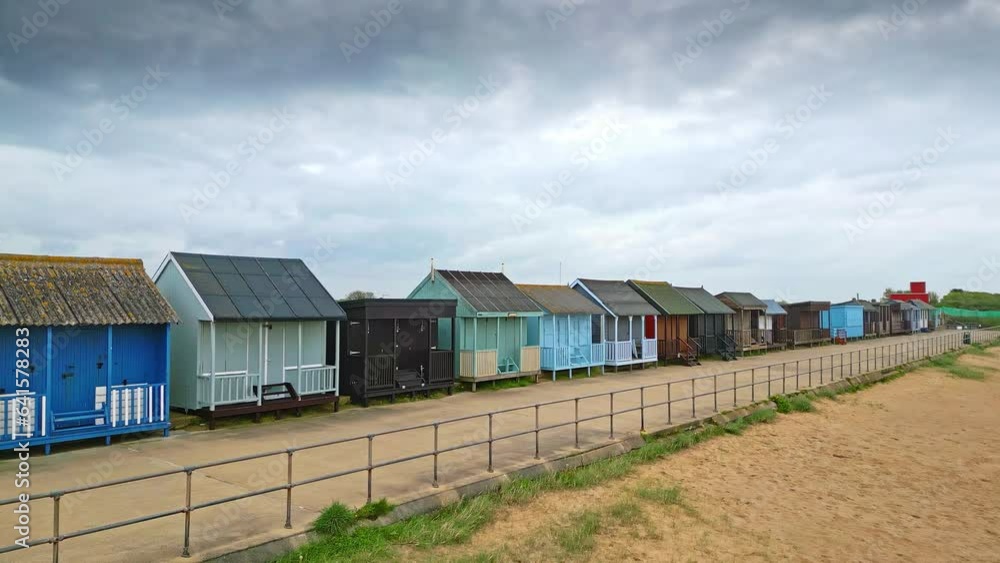 Explore Mablethorpe from above, revealing beach huts, sandy shores, amusement parks, rides, and the bustling holiday crowd. Explore Mablethorpe from above, revealing beach huts, sandy shores, amusement parks, rides, and the bustling holiday crowd.
