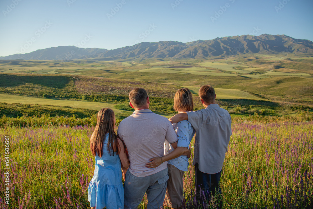 happy family in a field with flowers, mom, dad and children teenagers in nature
family in the mountains on a walk, purple flowers, mother, father, teenage children, happy family, family outdoor recrea