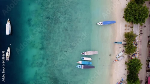 Top view of Gili Trawangan, West Nusa Tenggara. Panoramic showcasing boats, beach, and natural beauty.