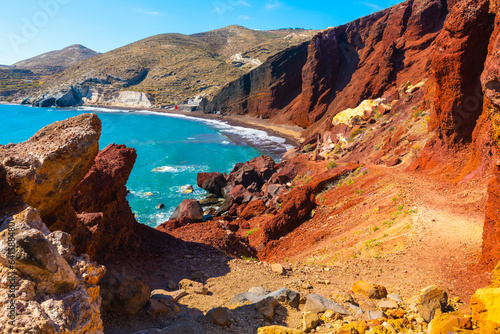 Red beach in Santorini island, Greece. Red volcanic cliffs and the blue sea