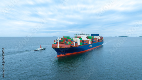 Aerial side view of cargo container ship carrying container from custom container depot go to ocean concept freight shipping by ship service on blue sky .Freight Forwarding Service © Yellow Boat
